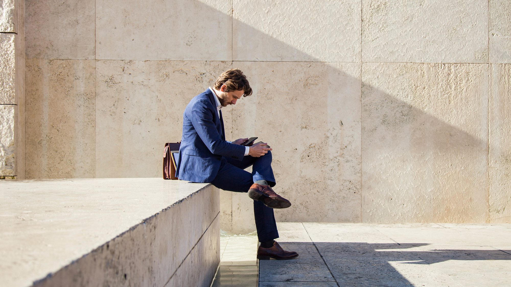 [Workplace wealth] Young businessman on phone